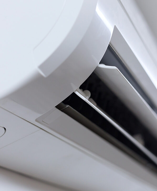 Family relaxing comfortably at home with a well-maintained air conditioning system