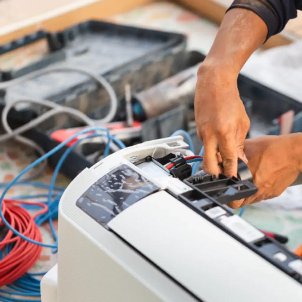 Licensed air conditioning repair technician diagnosing a split system in Melbourne