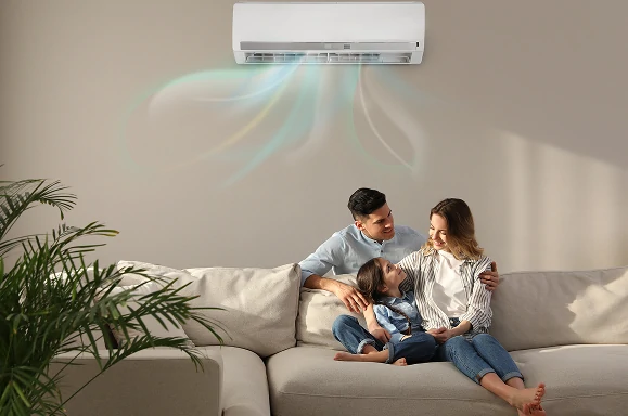 Family relaxing comfortably at home with split system air conditioning running in Melbourne